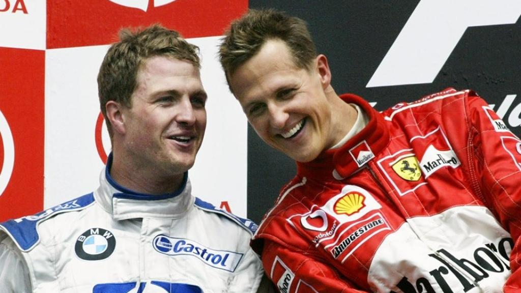 Ralf and Michael Schumacher pose together at the Canadian GP in 2003.